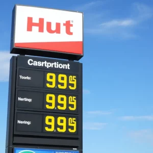 Gas station sign showing price of $2.75 for regular gasoline in Huntsville, AL.