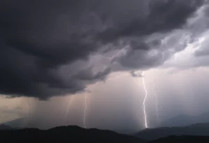 Dark storm clouds with lightning over Northern Blue Mountains during a thunderstorm