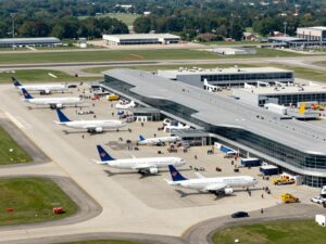 Aerial view of Huntsville International Airport showing busy terminals and aircraft.