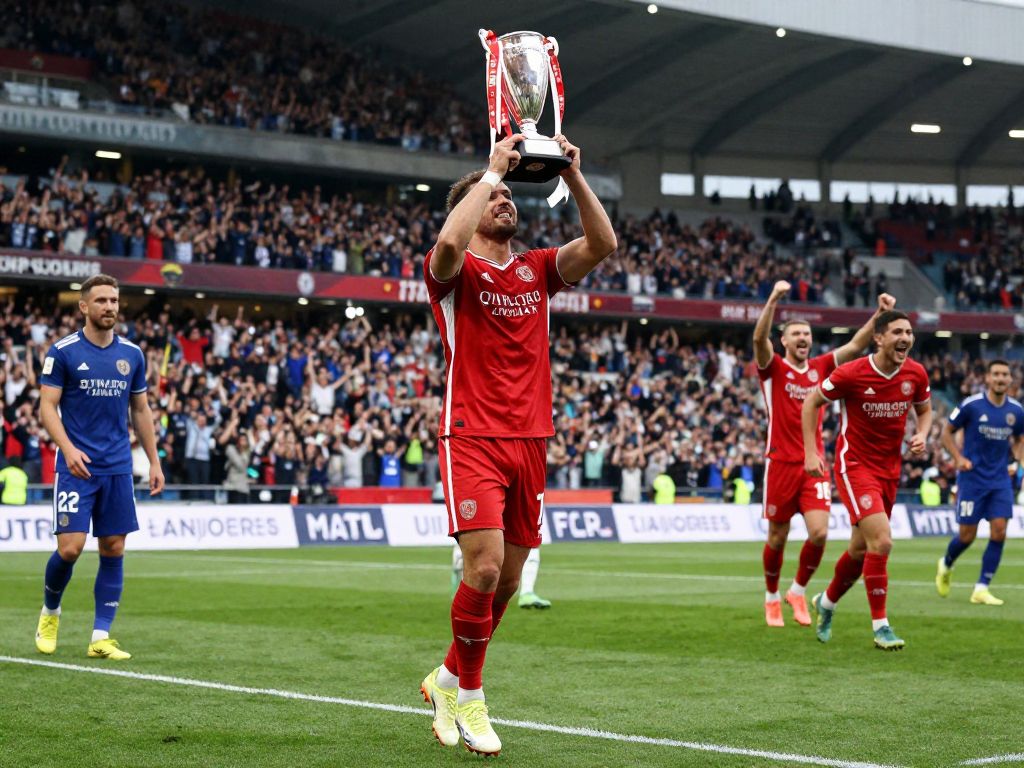 Football field and trophy representing achievement in sports
