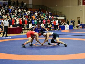 Young wrestlers competing at Alabama High School Wrestling Championships in Huntsville.