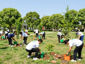 Community members planting trees during Huntsville's Arbor Day celebration.