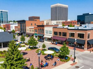 An overview of Huntsville's bustling economy with new businesses and community interaction.
