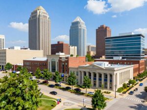 Cityscape of Huntsville, Alabama with modern architecture and community life.