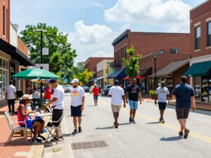 A bustling street in Huntsville with various local businesses.