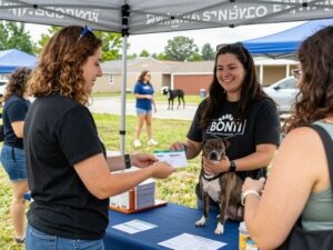 Drive-thru event for pet welfare in Huntsville, people collecting supplies for their pets